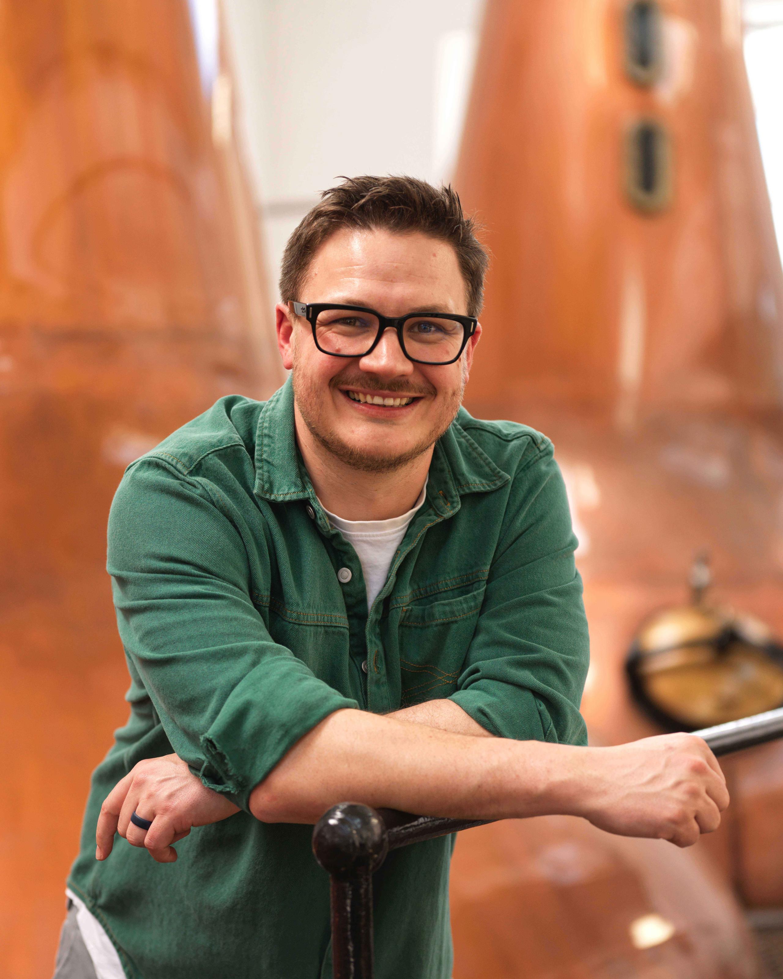 Marc Watson Master Whisky Maker Standing in Distillery